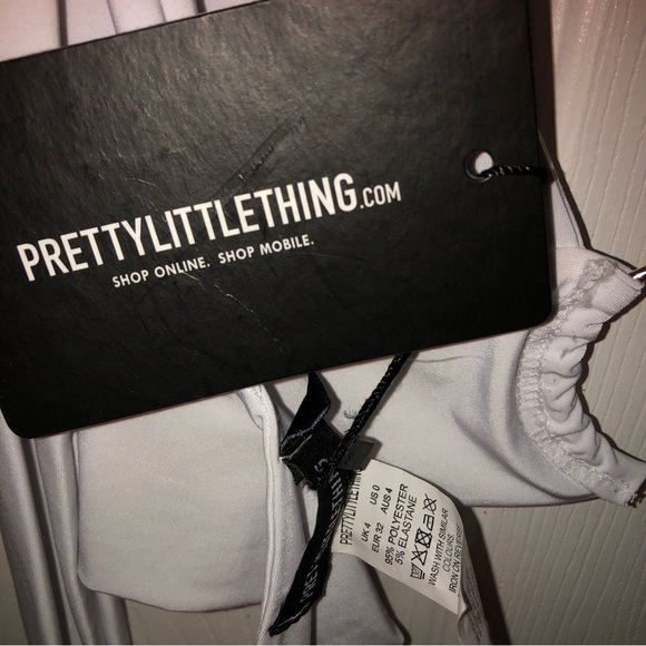 Pretty little thing, white tie top, ring in middle - Picture 2 of 4